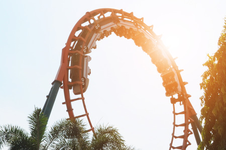 blurred Roller coaster ride in amusement park at eveningのeditorial素材