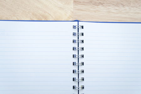 notebook on wooden table, view from aboveの写真素材