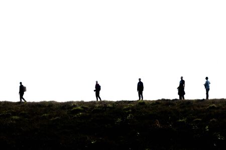 silhouette group of hiking on mountain with white background, subject is blurredの写真素材