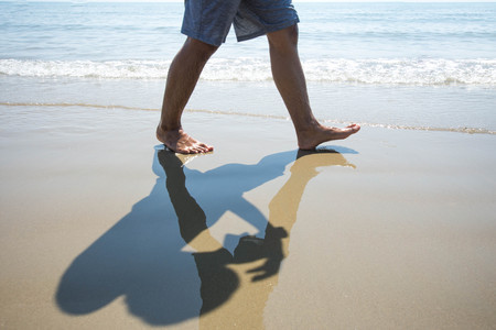 people walk on the sea beach. subject is blurred