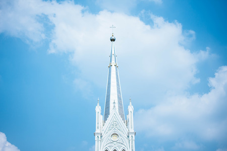 Beautiful blue sky and cloud with Nativity of Our Lady Cathedral at sunny day, Samut Songkhram provine, Thailand. soft focus.の写真素材
