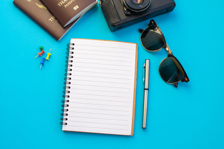 passport camera and notebook on color background.の写真素材