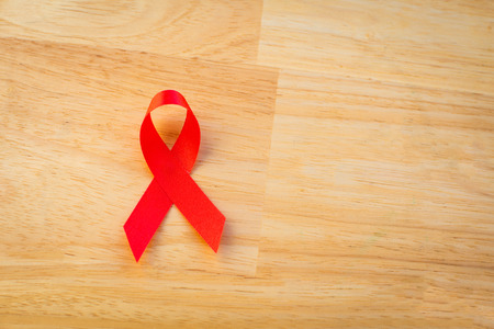 Red ribbon with World Aids day concept.の写真素材