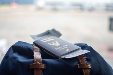 passport on backpack at airport waiting traveling. soft focus.の写真素材