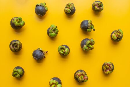 mangosteen fruit of Thailand on yellow background. soft focus.の写真素材