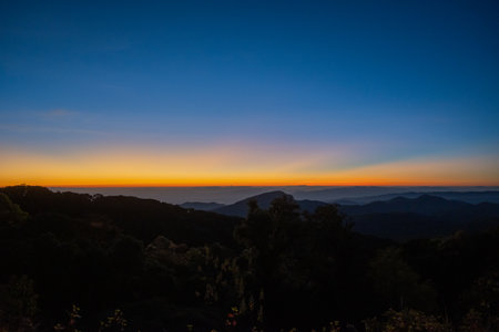 beautiful silhouette view of mountain at sunrise (Doi Inthanon National Park, Chiang Mai), soft focus and low keyの写真素材