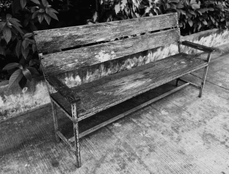 Black & White Old Bench with Wooden Planks and Rusty Steel Framesの写真素材