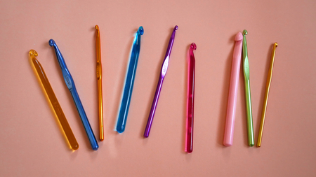 Colorful Crochet Hooks on Orange Backgroundの写真素材