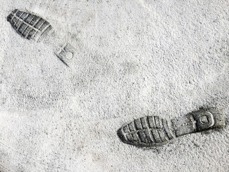 Footprints (Shoes) in Cement Roadの写真素材