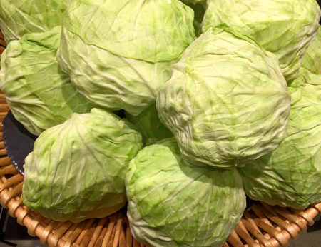Pile of Fresh Raw Cabbages in a Basketの写真素材