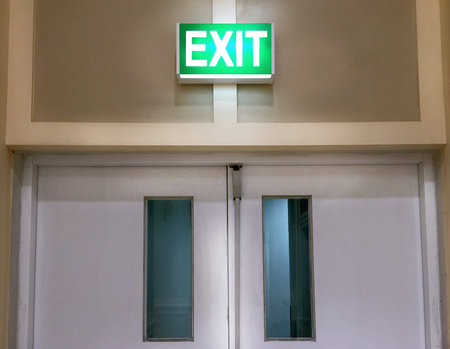 Door with Glowing Exit Labelの写真素材
