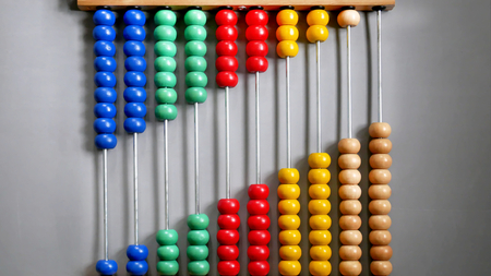 Abacus for Counting Practice, Beads Aligned Diagonally on Gray Backgroundの写真素材