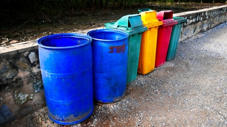 Grungy Old Trash Bins in a Rowの写真素材