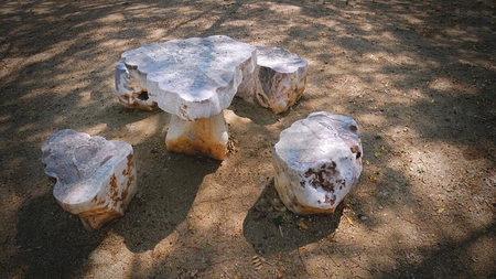 Set of Stone Table and Chairs in the Parkの写真素材