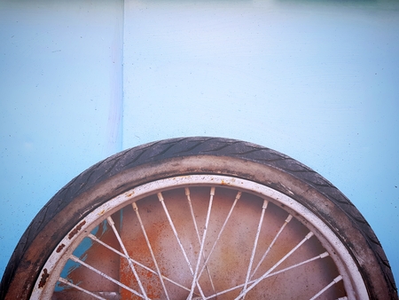 Close-up Old Rubber Tire Wheel of Cyan Cartの写真素材