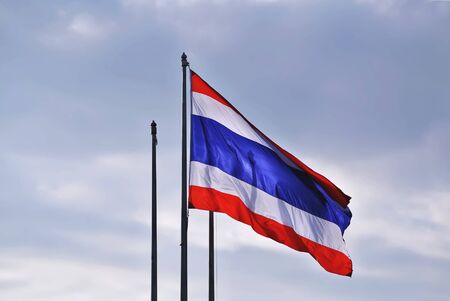 National Flag of Thailand In Blue Cloudy Sky