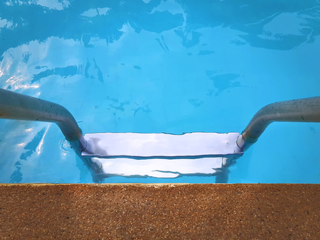 High Angle View of Swimming Pool Ladderの写真素材