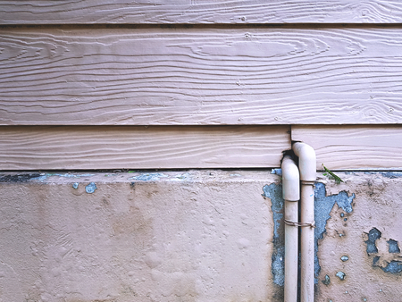 Water Pipes on Grungy Wooden Planks Wall