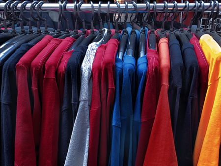 Colorful Casual T-Shirts Hanging on the Rackの写真素材