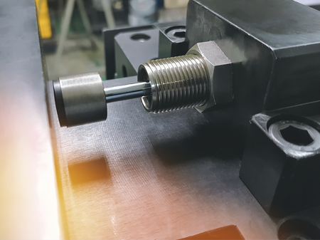 Close-up Metal Shock Absorber on Manufacturing Machineryの写真素材