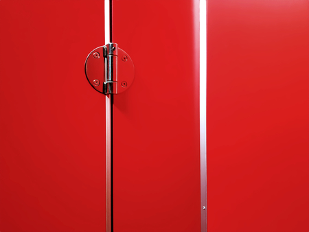Metallic Hinge at the Corner of Red Wall and Doorの写真素材
