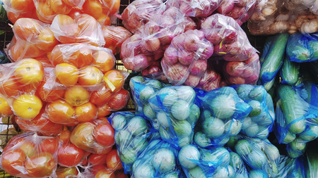 Full Frame Background of Various Kinds of Colorful Vegetable in Plastic Bagsの写真素材