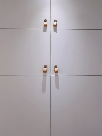 Closed White Simple Wardrobe with Leather Handles for Door Opening
