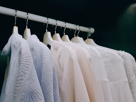 Group of Clothes for Women Hanging Inside the Wardrobeの写真素材