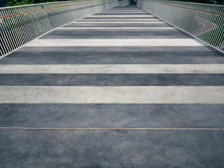 Striped Floor Elevated Walkway with White Railing Fencesの写真素材