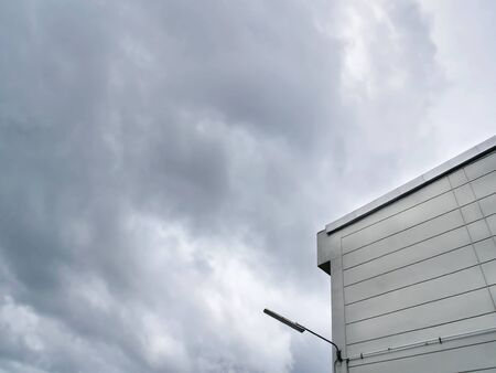 Low Angle View of Building Against Dark Moody Stormy Sky