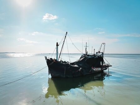 Tranquil Scenery of a Fisherman Boat Docked at the Pier