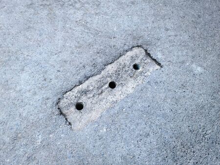 High Angle View of Rain Water Drainage Holes on the Roadの写真素材