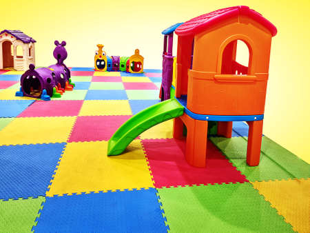 Colorful Playground for Kids Isolated on Yellow Backgroundの写真素材