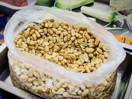 Pile of Peeled Roasted Peanuts in Plastic Bag as Cooking Ingredient