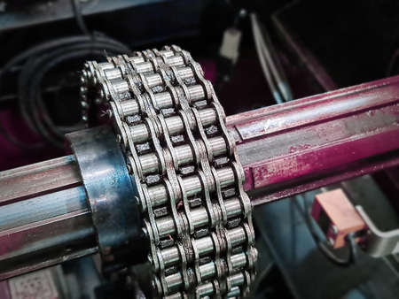 Close-up Steel Roller Chain Drive System with Spline Shaft on Old Machine