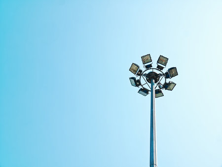 Low Angle View of Circular Lamps at Top of the Post Against Clear Blue Skyの写真素材