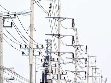 Perspective View of Row of Electrical Power Transmission Posts Against Clear Skyの写真素材