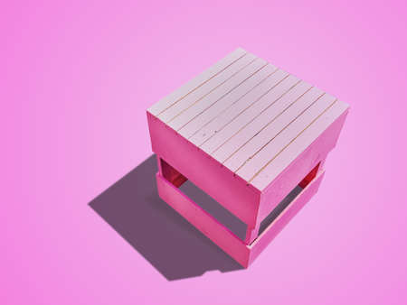 High Angle View of Pink Square Wooden Plank Chair Isolated on Pink Backgroundの写真素材