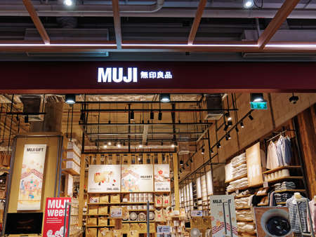 Sri Racha, Chon Buri / Thailand - December 4, 2021: MUJI Storefront with Neatly Arranged Goods on Shelvesのeditorial素材