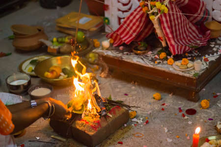 sacred fire burning during hindu religious rituals in local bengali culture. all the essential...