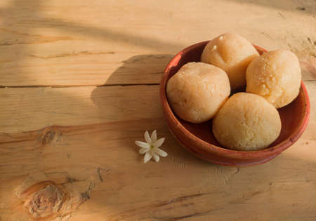 nolen gur rosogolla or rasgulla served on plate. brown spongy bengali indian traditional sweet made from cottage cheese and jaggery. winter special delicacy.copy space background.の写真素材