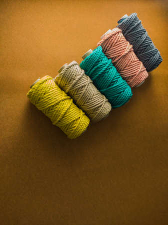 colorful reels of macrame cord threads or wool shot as copy space background or text background. studio shot.の写真素材