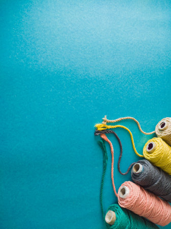 colorful reels of macrame cord threads or wool shot as copy space background or text background....