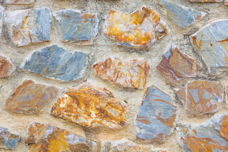 Old stacked stone wall background の写真素材