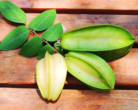 carambola (Starfruit) on wood backgroundの写真素材