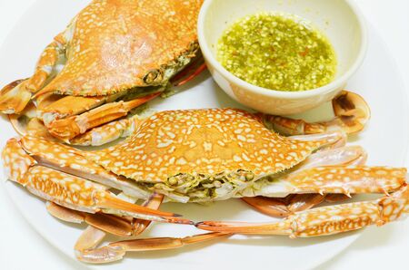 Steamed crap with spicy seafood sauceの写真素材