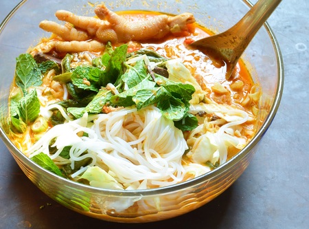 Rice noodles in fish curry sauce with vegetables