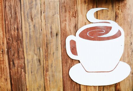 Coffee design on old woodの写真素材
