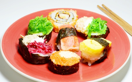 Sushi on red dishの写真素材