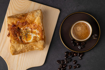 Breakfast with coffee and egg toast is the first hand of the day. top viewの写真素材